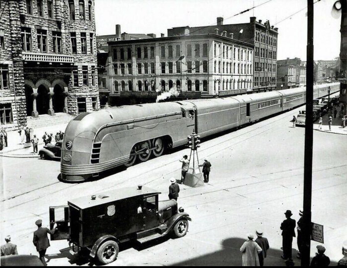 The New York central railroad streamliner Mercury passes through Syracuse city hall, 1936.