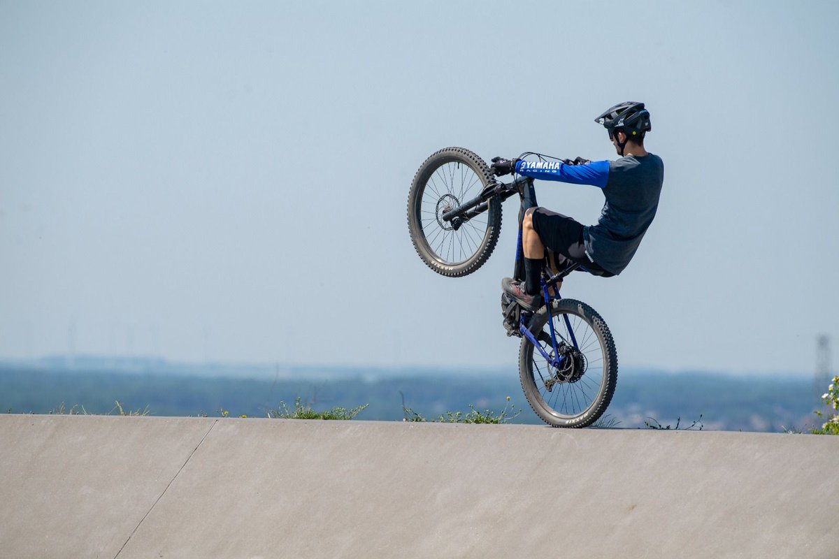 It’s #WheelieWednesday with a difference. Which current Yamaha rider is testing the monowheel capabilities of the Yamaha MORO 07 Mountain eBike in this photo?