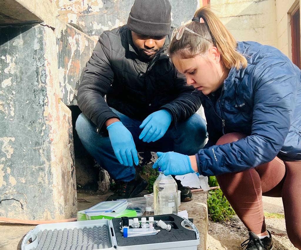 Rhodes University Biotechnology Innovation Centre (RUBIC) Water Testing Laboratory is out today sampling water across town to monitor E. coli and chlorine levels. Shannon Rutherford and Dr Nhamo Mutingwende are sampling at the Makanda Fire Department.
