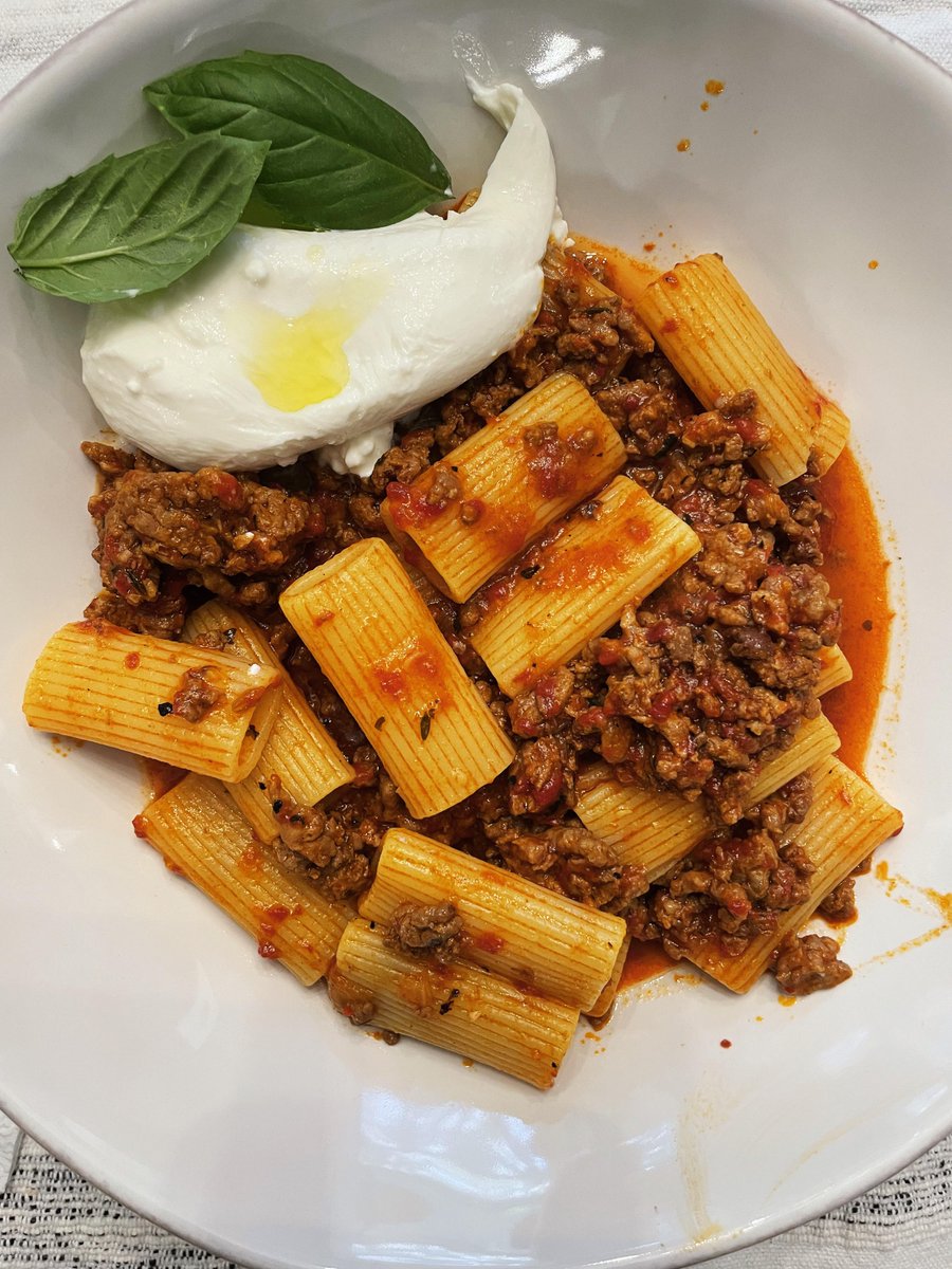 Roasted red pepper bolognese with sausage and beef, topped with burrata. #food #comfortfood #yummy