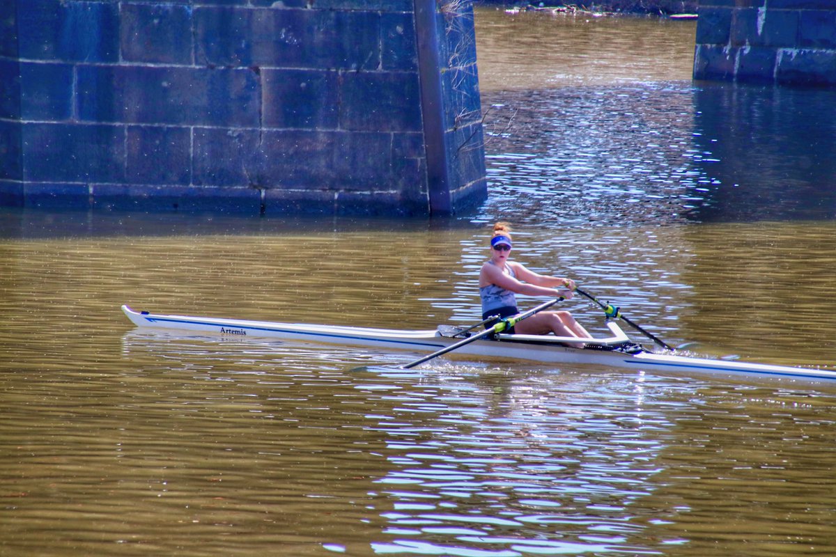A rower passes under a bridge on the Schuylkill River in Philadelphia. #rower #rowing #womenathletes #Philadelphia
