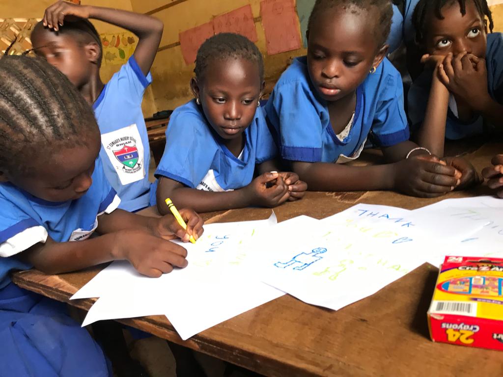 ChildFundGambia's tweet photo. Some of #ChildFund sponsored children writing and drawing "Thank you" farewell messages to the outgoing #UNICEF country rep, Gordon Jonathan Lewis, who is taking up a new role in UNICEF at regional level. 
Mr Lewis is a true friend of children!  
Best wishes in your new challenge https://t.co/XK7KpbNcro