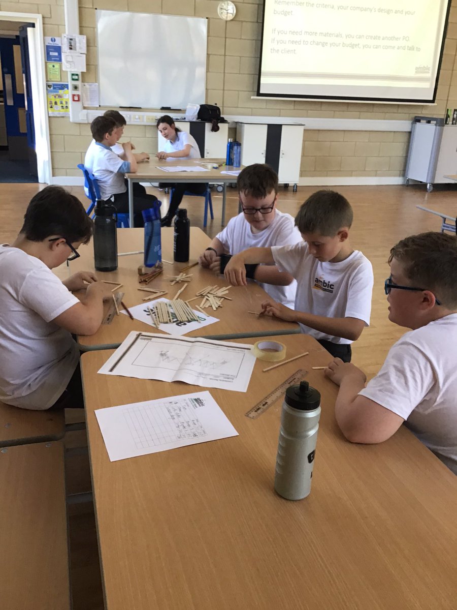 Charles Stewart are working really well in teams to build their bridge designs @Ambicltd1