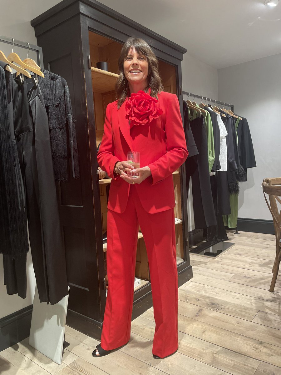 KathrynCumings's tweet photo. Liz, looking stunning in the AW23 Mint red suit, complete with corsage, at the Islington Press event last night 🔥@WeAreMV_ https://t.co/ur5Q7fqXYS
