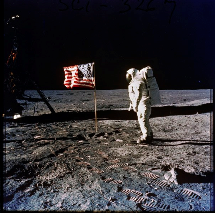 The photograph of Buzz Aldrin standing next to the U.S. flag on the moon is among the most iconic images in U.S. history. The image was captured during the #Apollo11 mission, the first human-crewed mission to land on the Moon, on July 20, 1969. catalog.archives.gov/id/593743 #FlagDay