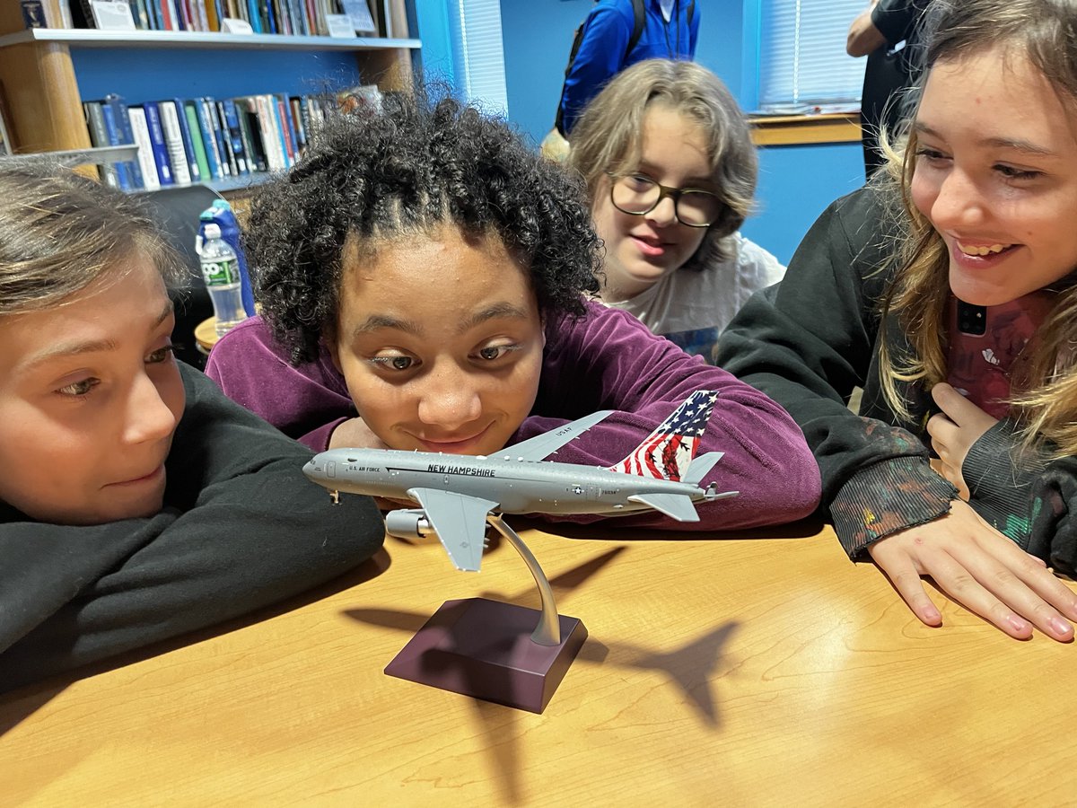AVMuseumofNH's tweet photo. It's Flag Day! There's no better way to celebrate than by letting students admire a 1:200 scale model of the NH Air National Guard's KC-46A Pegasus tanker with striking flag-themed tail designed by USAF veteran Shayne Meder, known among her service colleagues as "FlyGirlPainter." https://t.co/usAZ5NtpnV