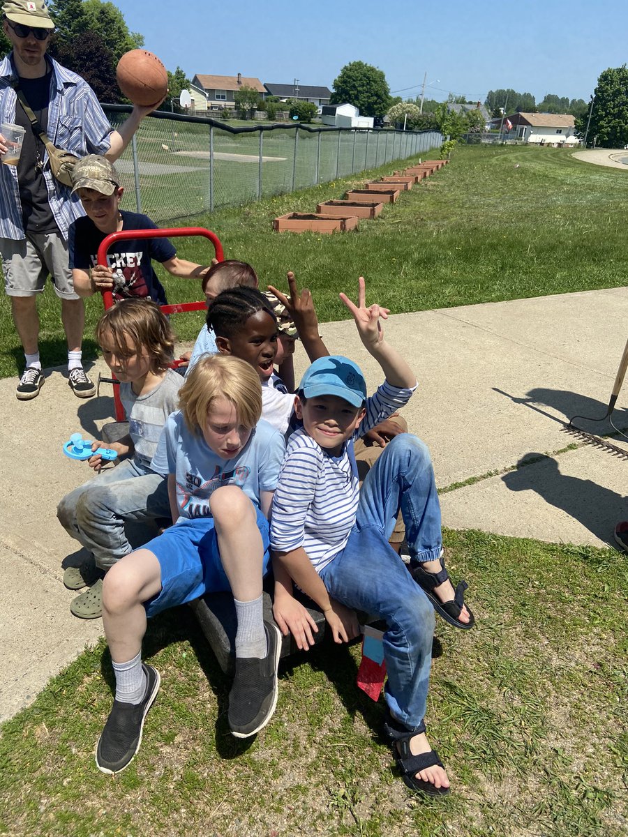 The grade 3 crew working together to do the last of the soil prep! They love getting dirty! Always best to top up hard work with some fun so they went for a ride on the cart! @asdnnb @PlayJouerCanada @takemeoutside @stemnorth #schoolgardens