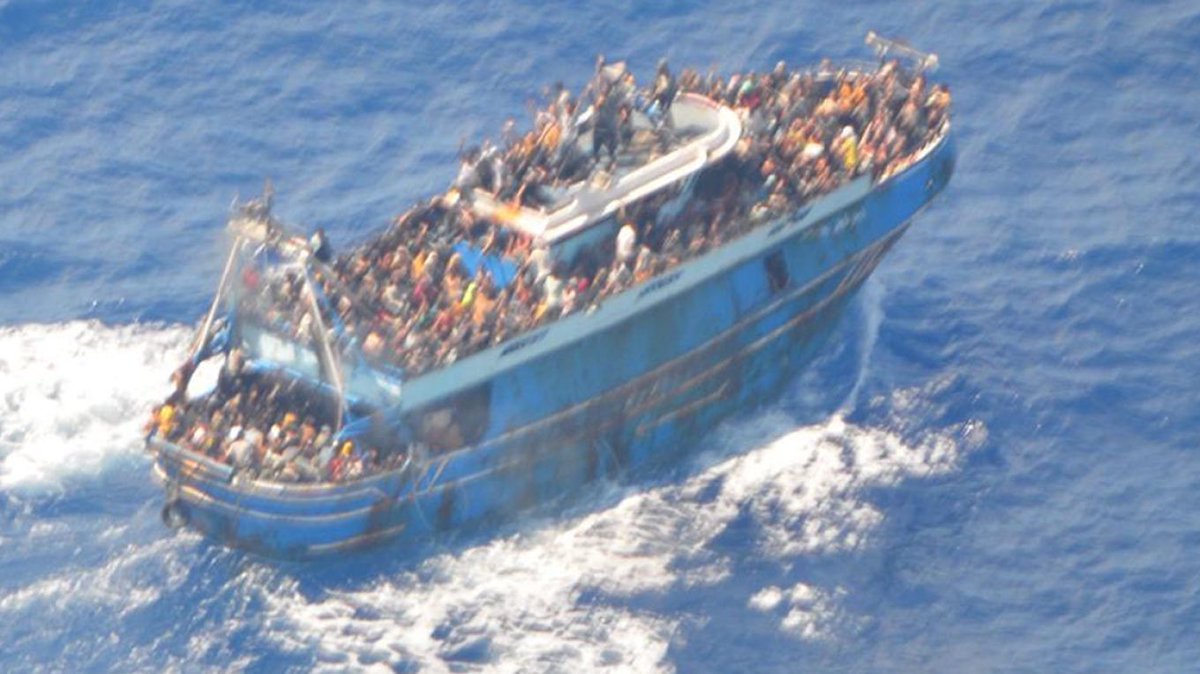 ABoatReport's tweet photo. The tragic shipwreck outside Pylos has made headlines not only in Greece but all over the world. 104 people was rescued, while 79 people have so far been found drowned, it’s expected that this number will increase. How many was onboard the boat is unclear, numbers varies from 400 up to 750 people.

One thing is clear, it’s the deadliest shipwreck outside Greek shores for decades, so far 79 is found drowned, while 104 was rescued, the numbers of missing and assumed drowned would be 567 people if there were 750 people onboard, that would put the total death toll to almost 650 people.

At first I thought that the number 750 people was highly exaggerated, but when I saw the picture of the boat, packed to the rim outside on deck, I’m not so sure anymore, we must assume that there were hundreds of people inside the boat packed like sardines.

The rescued and the drowned found is most likely the people we see outside the boat, anyone inside would be immediately trapped when the boat capsized, they would have no chance to escape and go down with the boat.

According to testimonies from survivors the boat was packed with people, outside and inside, inside was mainly women and children while the men was sitting outside. If this information is correct, most of the survivors and drowned are men, since they were the ones sitting outside on the boat.

Pictures published after the people arrived in port support the theory that the survivors was mainly men, no woman or children was in any of the published pictures, as far as we can see.

The chance of finding people who was trapped inside the boat when it went down, would be extremely difficult, the boat is now resting on the seabed 5.000 meters below sea level.

Number of missing is unknown, testimonies from survivors say everything from 400 to 750 passengers, we will probably never know exactly how many was onboard.

All survivors was taken to port in Kalamate, approximately 30 people needed medical care and transported to hospital, and will eventually be taken to the reception and identification center in Malakasa. Nationalities of the people onboard was reported to be from Syria, Afghanistan, Pakistan, Palestine and Egypt.

Greece’s caretaker PM Ioannis Sarmas declared three days of mourning for the victims of one of the country's deadliest shipwrecks involving refugees.