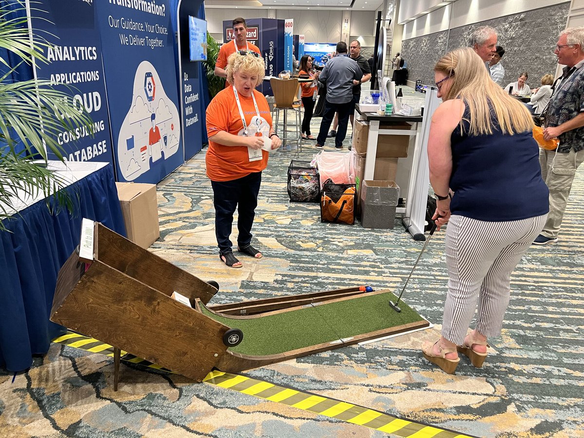 datavail's tweet photo. #Throwback to our thrilling #PuttSkee experience at booth #401 #Ascend2023! Attendees had a blast as they showed off their putting prowess and competed in friendly competitions. Don't miss out on our future events. Stay tuned! https://t.co/8kGY4zkGhd

#Oracle #oracleconference https://t.co/BQDc4Hk0mC