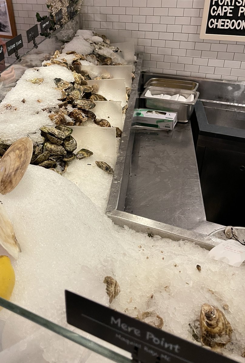 Delicious oyster dinner and peach margarita at @ChelseaMarketNY 🦪  this dish has 12 different types!