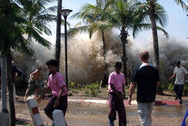 Seawater splashes in the air as the the first tsunami waves hit Ao Nang, Krabi Province, Thailand, during the 2004 Indian Ocean tsunami that killed over 220,000 people.