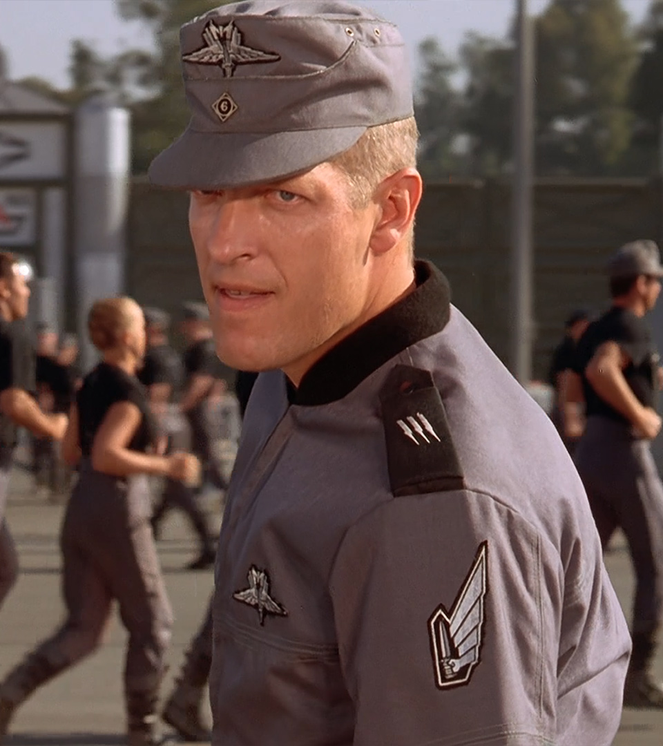 Dina Meyer & Clancy Brown in STARSHIP TROOPERS