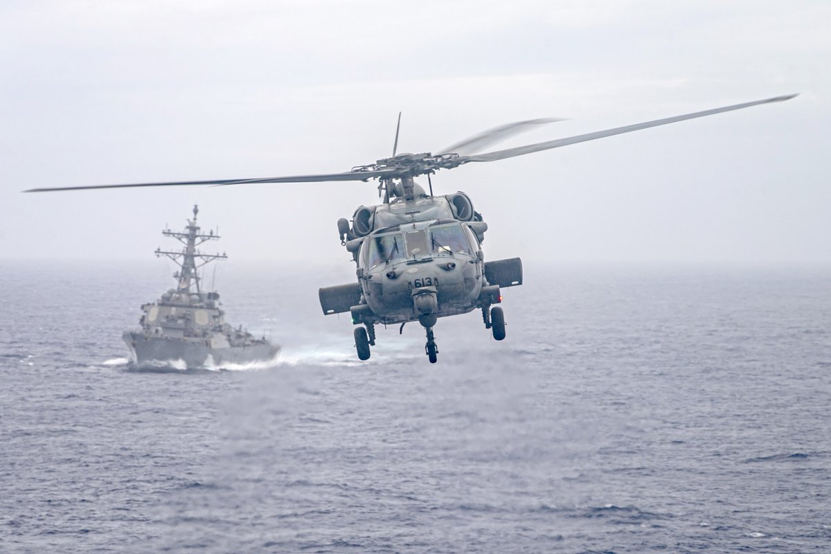 USNavy's tweet photo. #USNavy Photos of the Day: 

1️⃣ #HS6 helicopter flies near #USSDecatur and 2️⃣ #USSNimitz @NimitzNews #VERTREP in the Pacific Ocean @US7thFleet @INDOPACOM
3️⃣ @LHD5 monitors air traffic and 4️⃣ #USSCarterHall transits the Atlantic Ocean @US2ndFleet
👉 https://t.co/aZddB6hxYf https://t.co/pKX0aVyeWz