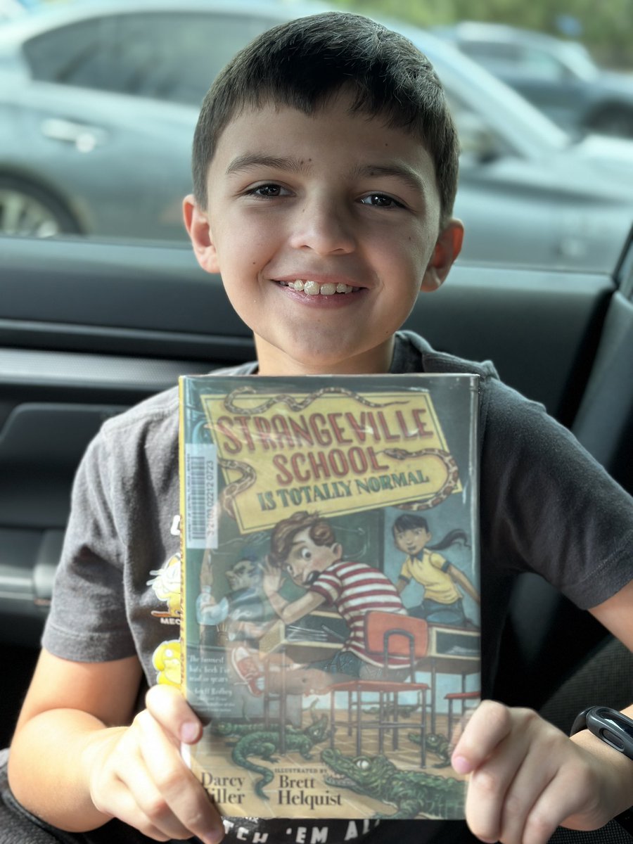 Ferguson_OCPS's tweet photo. Reading in the car while waiting on his sister! This will be his 6th @FloridaSSYRA book of the summer! 🙌🏼 #OCPSreads #BingoSquare #ARSreads https://t.co/VEvDdNpE08