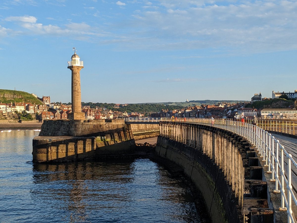 jwilsonsaid's tweet photo. Late evening shadows: the pier disappearing into the harbour #Whitby https://t.co/MWNNZUkLet