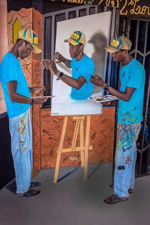 Angolan artist paints himself painting himself. So many talents in Africà.