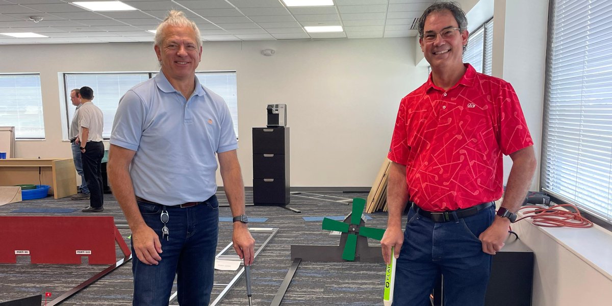 costrategix's tweet photo. Congratulations to Kevin and Lincoln, winners of our competitive mini-golf championship, the Gixer Open! Our course at "Carver Woods Country Club" includes a working windmill, "mousetrap," and a floating water hole. Course architects Kevin and Greg OUTDID themselves! #Wellness https://t.co/D3U7lLlqDn