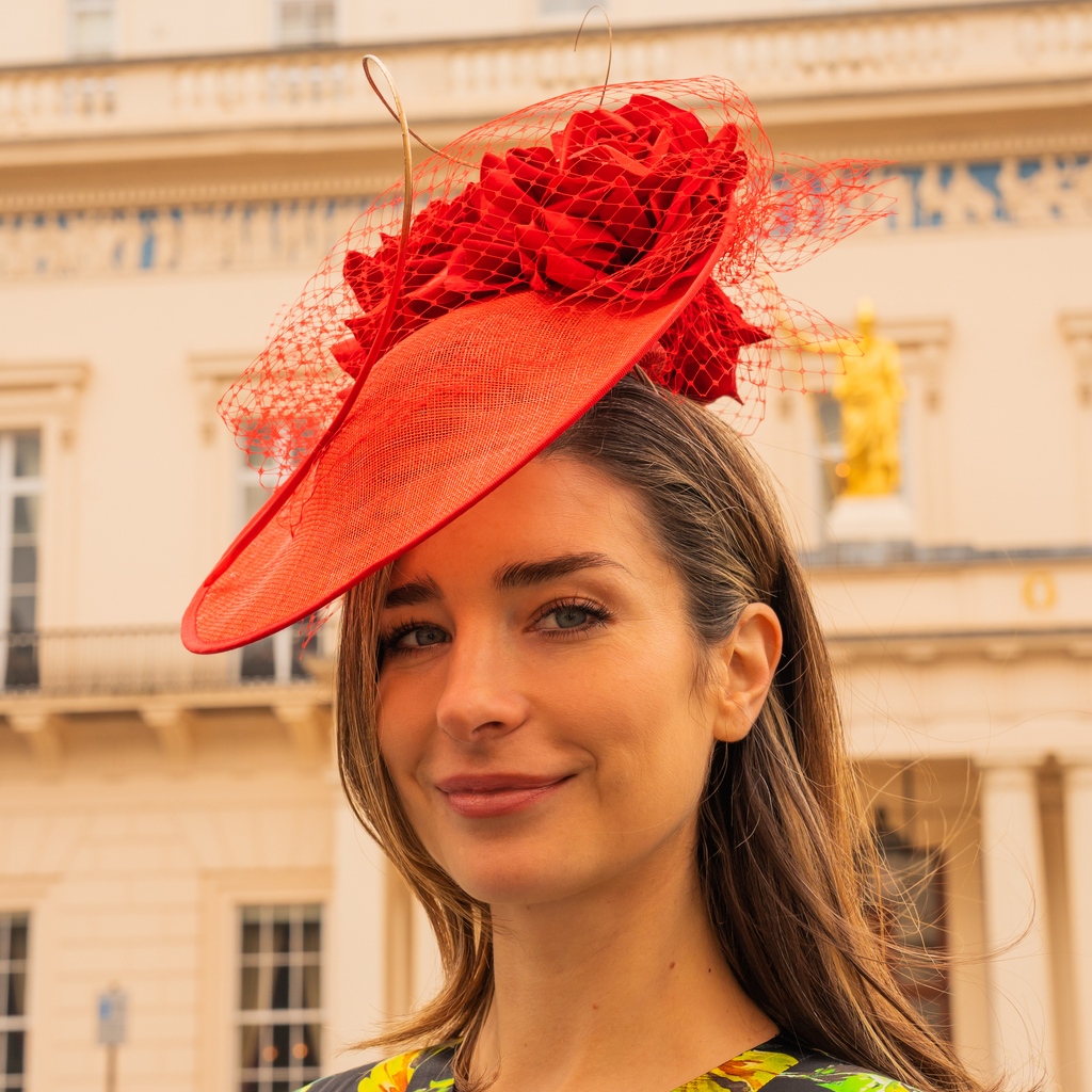The Twyla II saucer hat has 360 degree drama, upturned at the back and dressed with silk roses you'll be camera ready from every angle!

#twylahat #redhat #weddingfashion