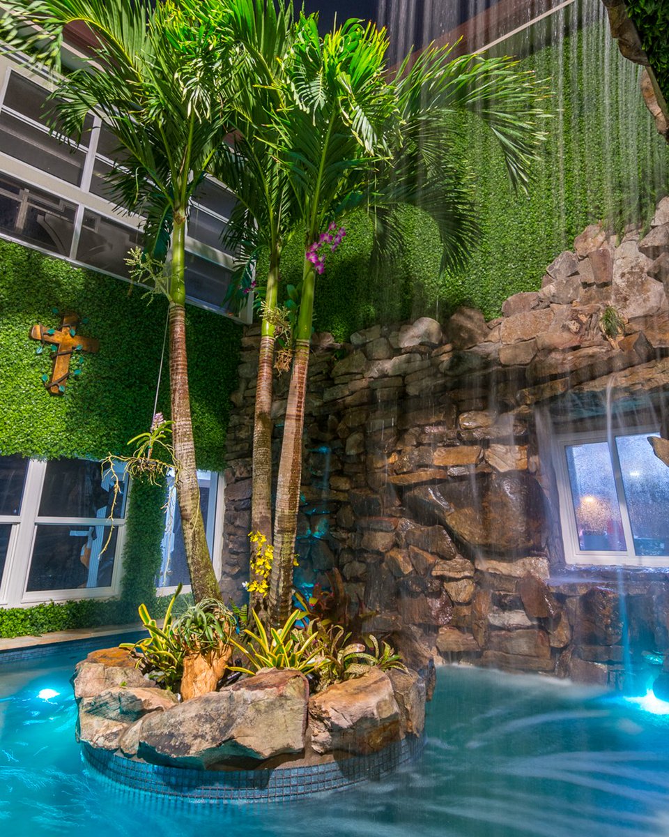 #tbt #fanfavorite Pool-A-Vida. This South Florida custom pool is the ultimate jungle backyard that includes a beach volleyball court, a huge swim-in grotto, and a spa complete with a giant water wall and a rain curtain!

#insanepools #lucaslagoons #poolbuilder #pool