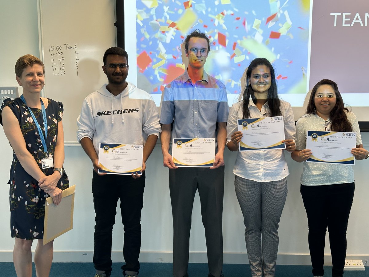 SurreyIoE's tweet photo. Winners of our amazing 24+hour #GenAI #Hackathon – their friendly chatbot, Steve the Stag, supporting students’ wellbeing, stole the show. (l–r: Martine Carter @mcarter79 VP Strategy, Planning, Performance, with winners Priya Krishna, Priyanka Nathani, Jack Hilliard, Yash Kulthe) https://t.co/82yV3s0k3f