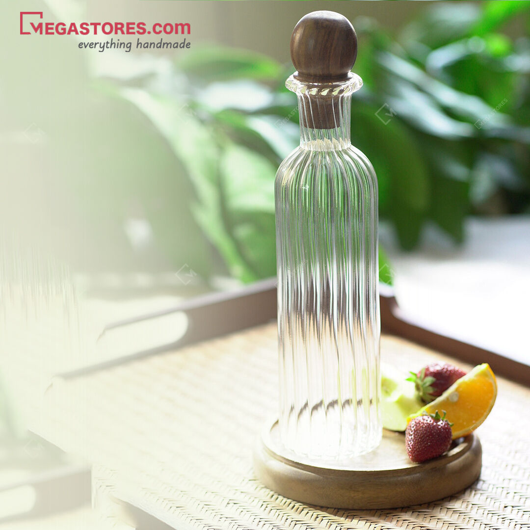 The Neer Glass Carafe is a blown glass flask that comes with a contrasting Sheesham cork. 

Shop now: bit.ly/MSGlassBottle
.
.
.
.
.
#megastores #glassbottle #vintagestyle #uniquefinds