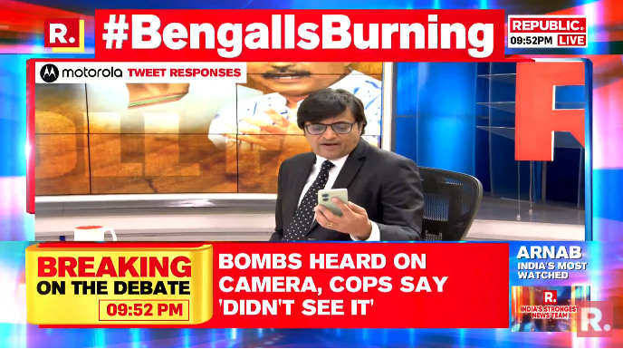 republic's tweet photo. #BengalIsBurning | The Motorola moment with Arnab is now LIVE, he is now reading your tweets on The Debate - https://t.co/EJrNwVoMM9
#WestBengal #PrePollViolence #TMC #MamataBanerjee #PanchayatElections https://t.co/Ila9ipzoRJ