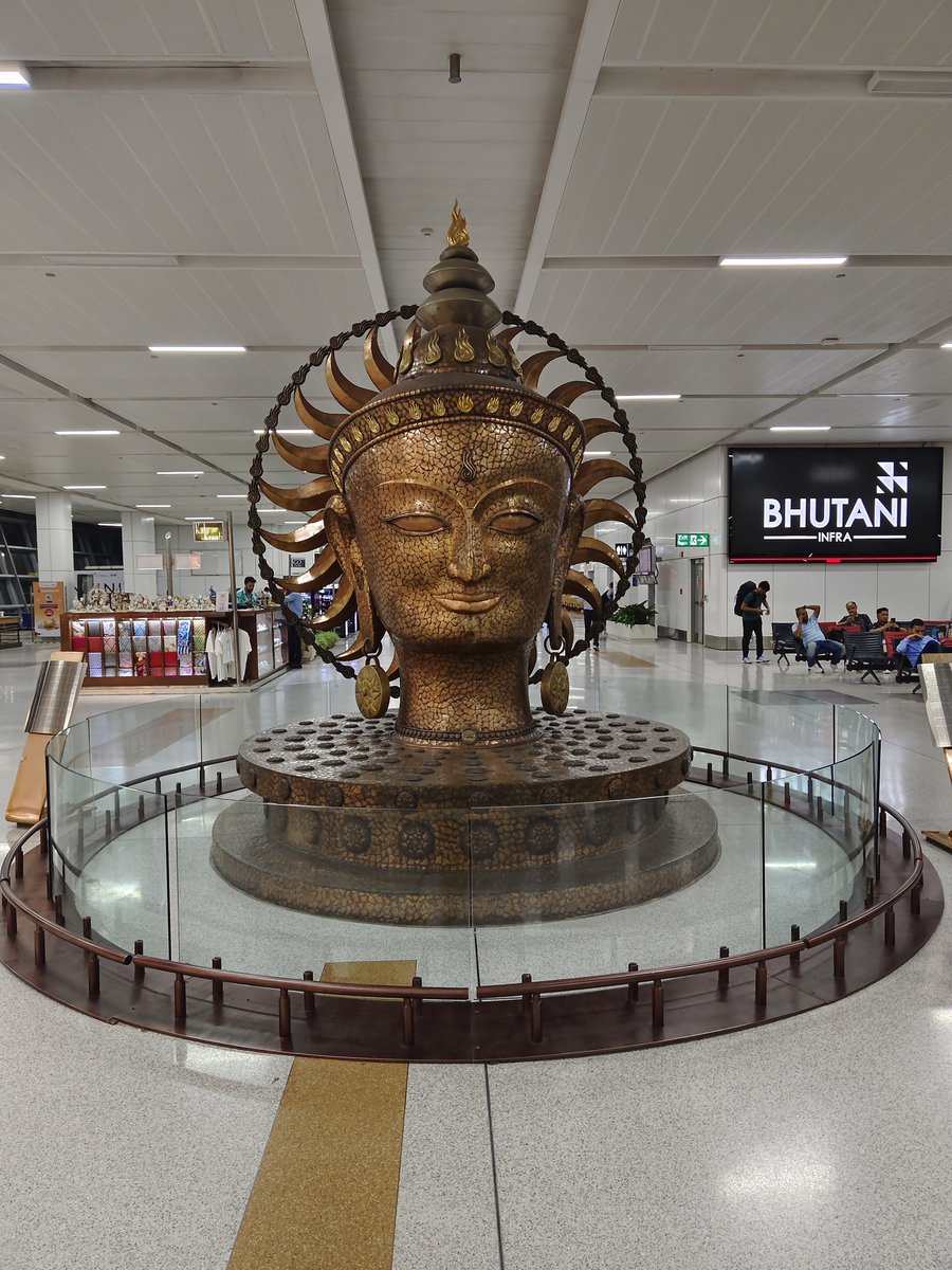 Boarded my first ever international flight just now. Going AWOL for a while. Meanwhile, ponder on this:

The plaque beside this art piece at Delhi T3 says this is the Sun God. It doesn't fit well with the Tanatani Drummers claims of Formless Gods in the Vedas. So, what is it?