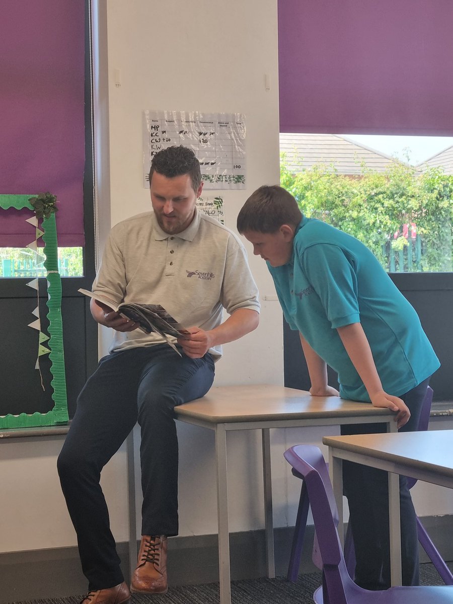 Look who got caught reading for pleasure! This student couldn't wait to share his excitement for our new reading books with the Head of Centre today. #readingforpleasure #SEVvalues