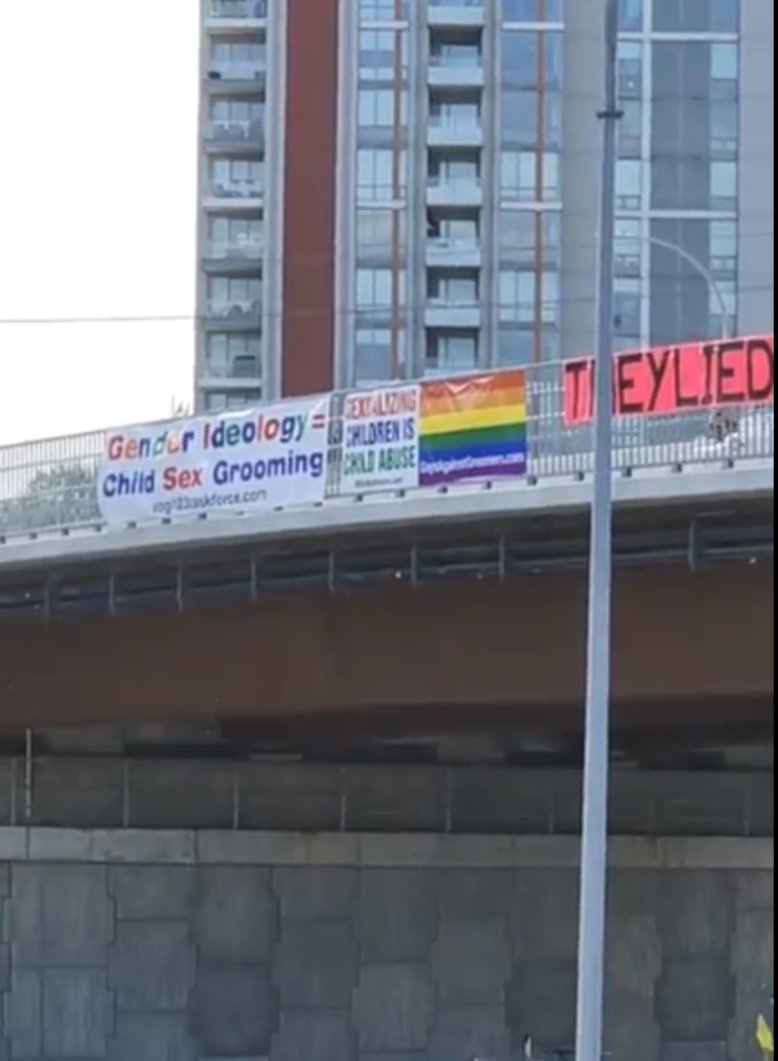 Today on the Keith Road/Seymour Pkwy Interchange. 'Gender Ideology = Child Sex Gr--ming' is an ad for the horrifically transphobic SOGI International Taskforce. 'Sexualizing Children is Child Abuse' is an ad for local transphobe Harm Bomm & the hate org Gays Against Gr--mers