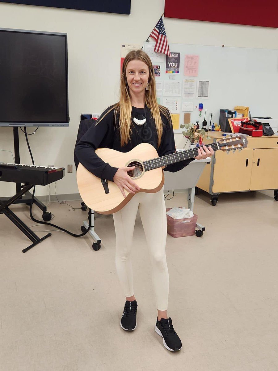 Today the San Diego Music Foundation donated 12 guitars to Crawford High School, with proceeds from this years SDMAs. Pictured is Erin Roberts, instructor for the Crawford High music program, showing off one of the guitars. Thanks to Taylor Guitars for our long time partnership!