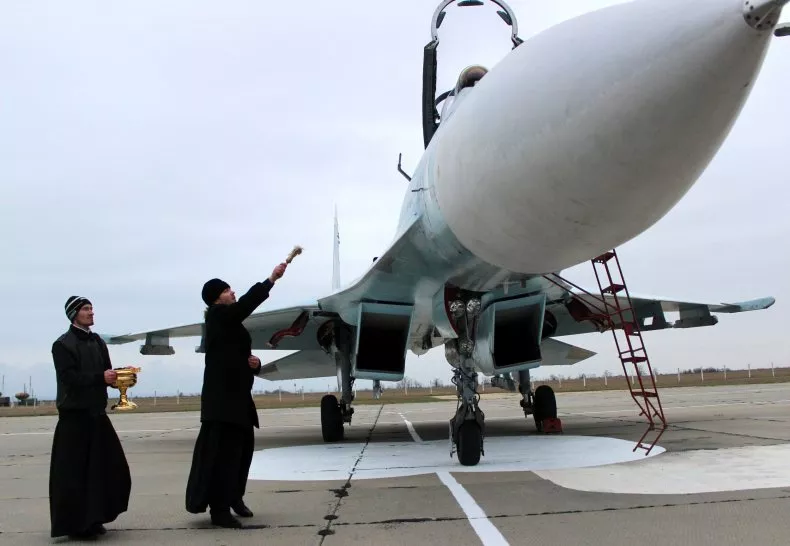 Moscow Patriarchy priests have been blessing fighter jets and other weapons of war with *holy water* for years. It's been very clear for a very long time they're not about pacifism. The photo below is from Crimea, 2014.