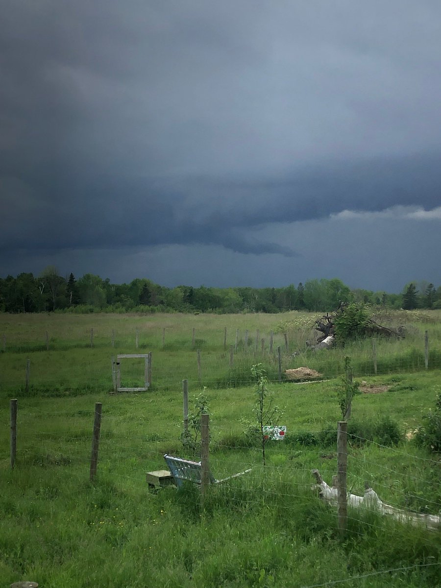 Photo of #nsstorm taken by my sis in Kempt Shore, Nova Scotia a few minutes ago (so ~5:45pm Atlantic). Looks like updraft? Supercell experts from #abstorm may be able to help identify the wedge shape. Thx!!