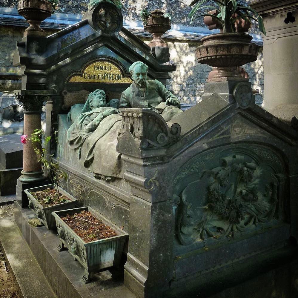 The amazing grave of the French inventor Charles Pigeon (1838-1915)  in Cimetière du Montparnasse, Paris. Charles is shown in bed next to his dying - or dead - wife, who passed in 1909.