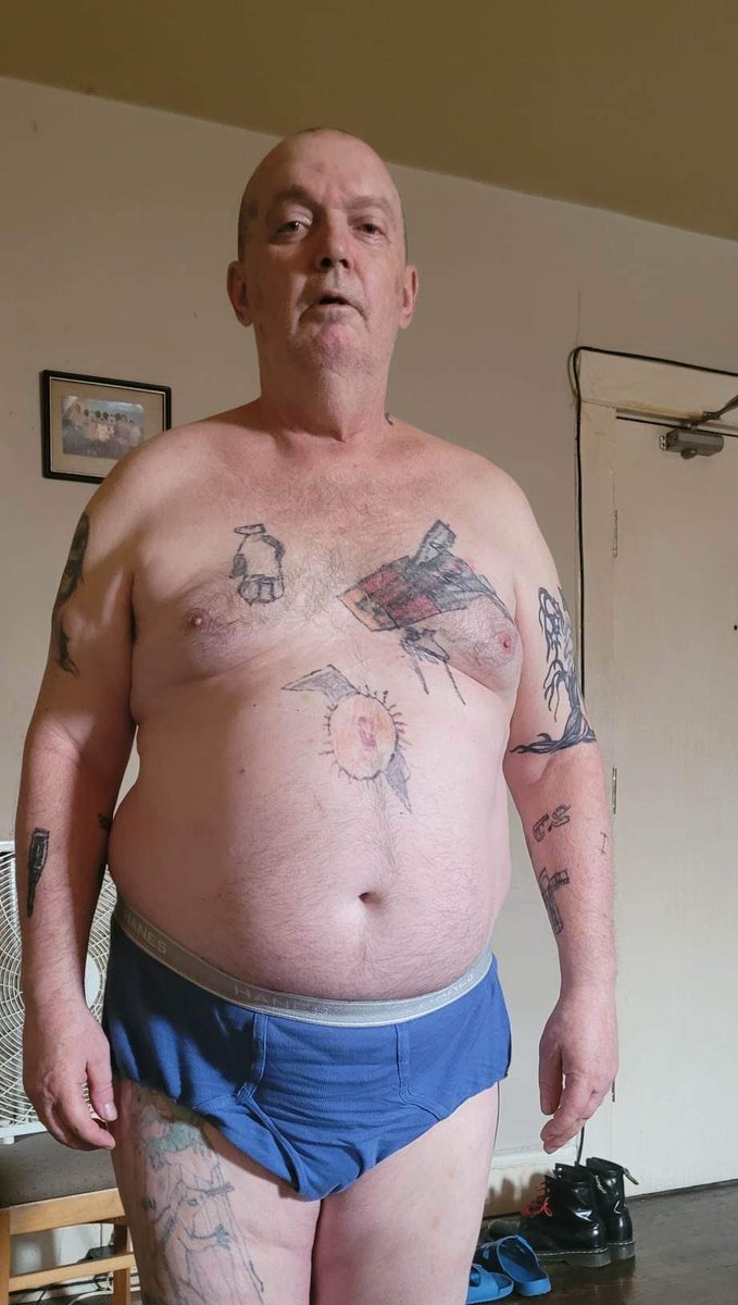 This is my daddy. We watch movies together and he cooks good chicken for me. He has so many cool tattoos he did himself.