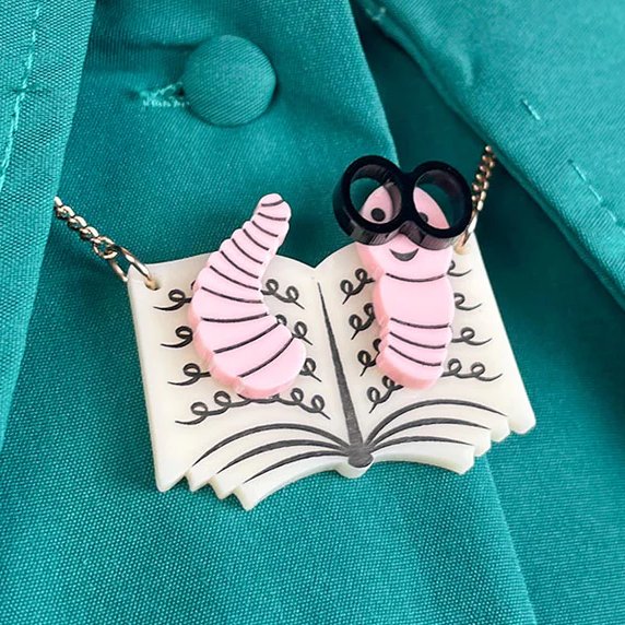Complete with statement specs, our Bookworm Necklace is the go-to for any literary lover: bit.ly/3G0ccLX 🪱