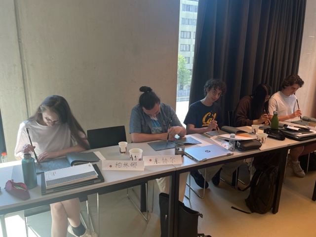 AUC_MLC's tweet photo. The Chinese class had a session with calligraphy and wrote a note with ink and brush for the coming Dragon boat festival (a Memorial Day for an ancient poet/official-Qu Yuan on 22 June) https://t.co/tcpZnrYK3C