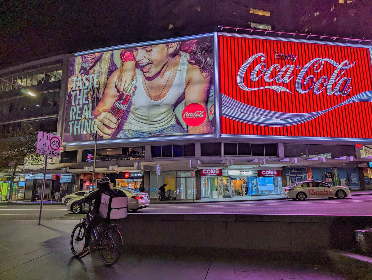 rustycompass's tweet photo. How should we feel about the delivery driver economy that's in our face every time we step outside at night? Feudal throwback?

#feudal #deliverydriver #sydney #kingscross #tech #delivery #cocacola #travel #streetphotography #urban #streets #nights #cities #gigeconomy https://t.co/0IZCV8EAL1