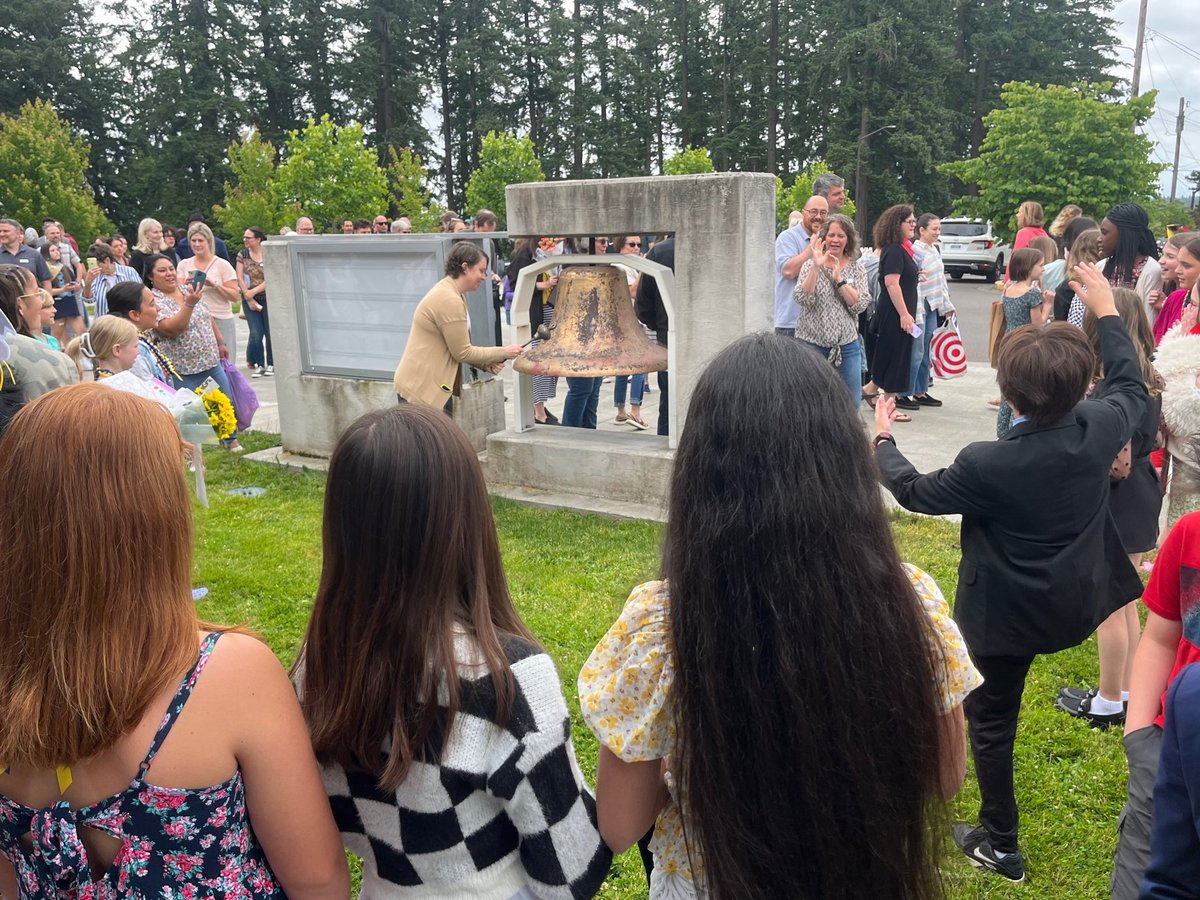 5th grade promotion traditions: a song, the school-wide "clap out," and the ringing of the bell.