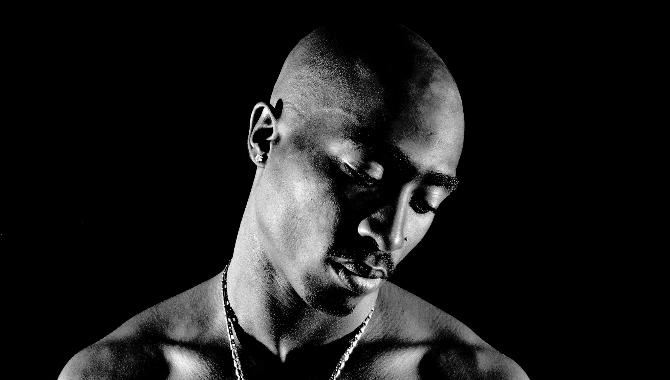 RecordingAcad's tweet photo. “Long live the rose that grew from concrete when no one else even cared.” - @2PAC 

🎵 The highly influential hip-hop artist has had several GRAMMY moments including presenting a golden gramophone on stage with @KISSOnline at the 1996 #GRAMMYs along with his six nominations. https://t.co/flfN9U7rcP