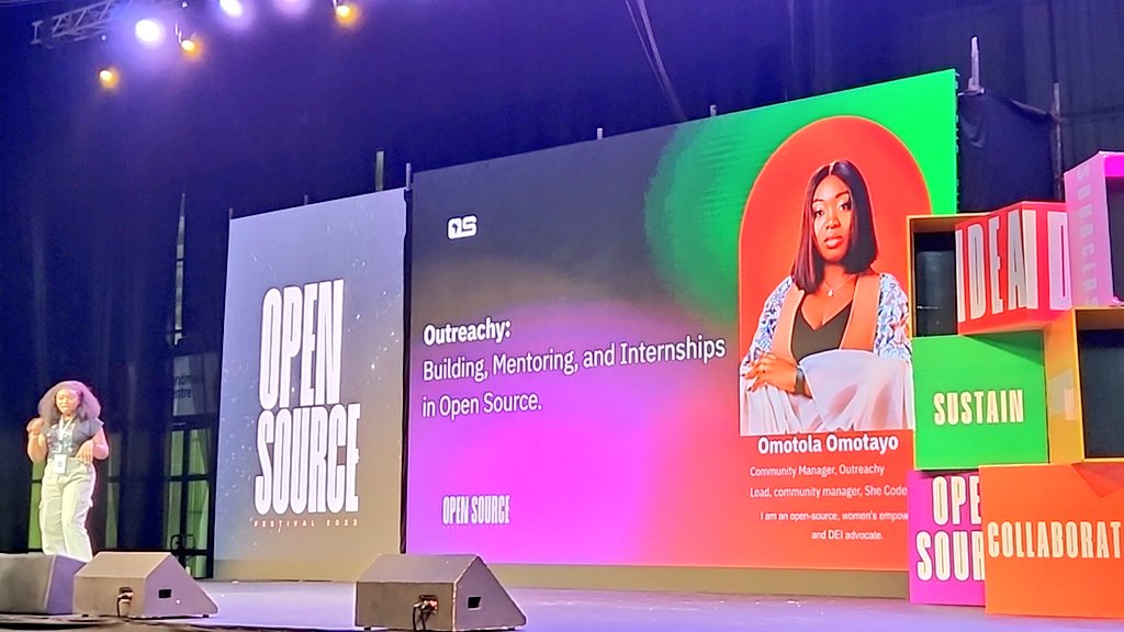 Here she is! It's @elegant_tolly on stage at @oscafest, talking about @outreachy, #mentoring, and leveling up an #OpenSource career. Let's goooo!