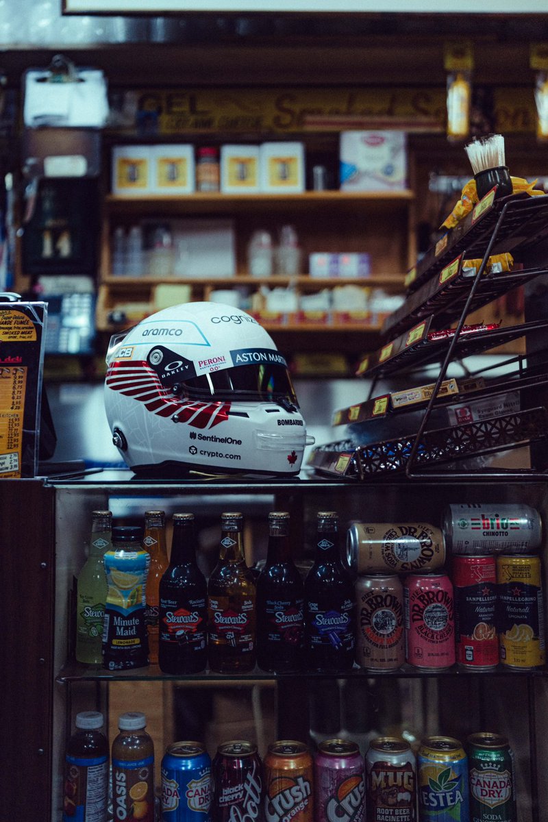 AstonMartinF1's tweet photo. A special lid for @lance_stroll ’s home race, featuring QR codes linking to places close to his heart. 🇨🇦 

#CanadianGP https://t.co/rCefJg38zV
