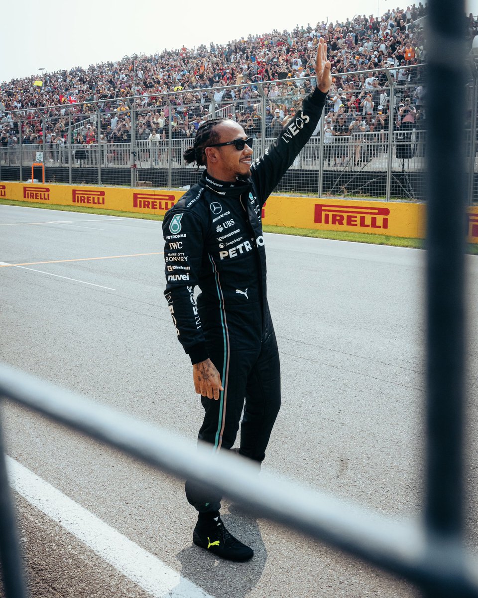 MercedesAMGF1's tweet photo. Heading out to see the fans during the red flagged FP1. 💜👏 https://t.co/RL3eEybab7