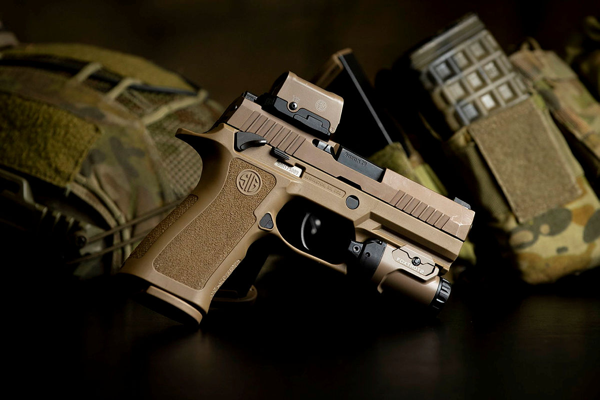 sigsauerinc's tweet photo. Welcome to the family 🙌

The SIG SAUER P320 was recently selected as the Australia Defense Force's Sidearm Weapon System. The Australian P320 XCarry will be complemented with a ROMEO2 reflex optic and a FOXTROT2 white light illuminator.

The program is part of the Lethality System Project (LAND 159), which will replace or upgrade several major weapons systems used by the ADF’s dismounted combatants.