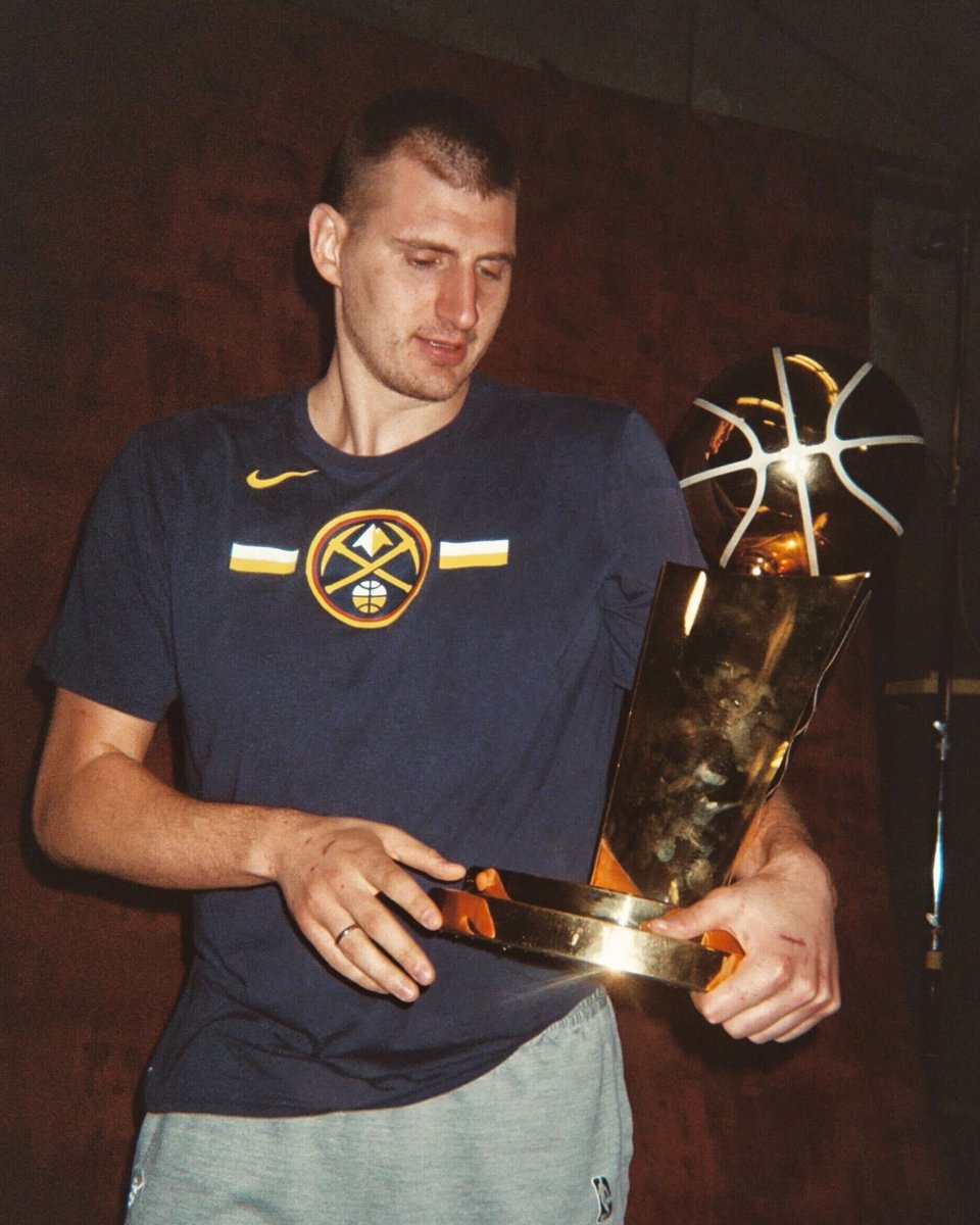 NBA's tweet photo. Joker holds the Larry O'Brien Trophy 🏆

📸 #NBAFinals MVP on film https://t.co/ydTrTWXz9Q