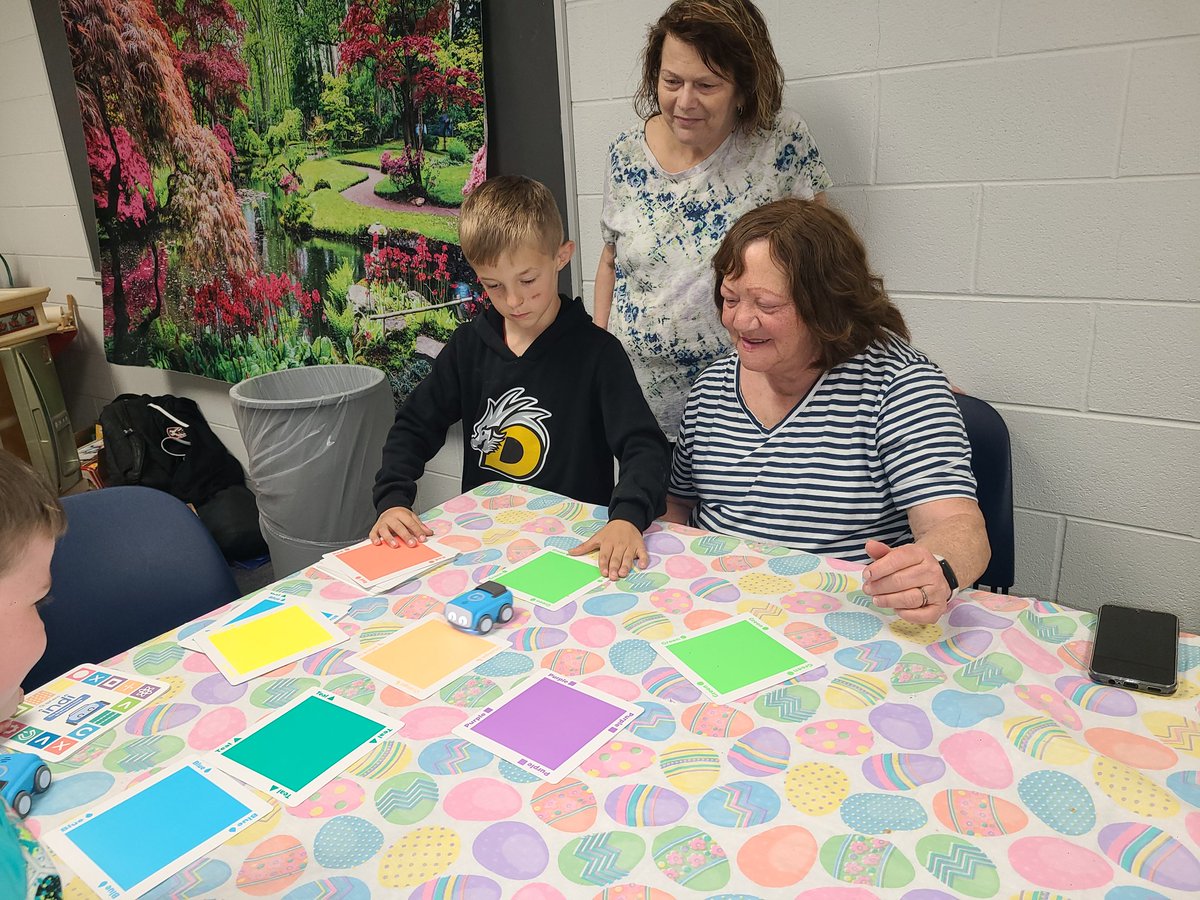 SCOPESUnioto's tweet photo. STEAM Ambassadors Case and Dane from first grade teach our foster grandparents from COAD how to code with the indi sphero robots. Thank you, Martha Holden Jennings, for these amazing robots!!!! https://t.co/GB54f2jyZP