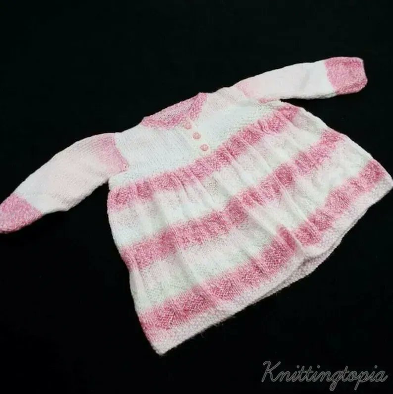 Hand knitted baby cardigan in pink and white to fit 3 - 6 months buff.ly/3MPvWpw #knittingtopia #etsy #knittedbabyclothes #knitwear #babyclothes #mummybloggers #etsyRT #tweeturbiz