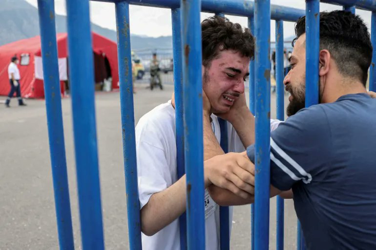 You might be wondering what we want to show you in this picture but listen:
The boy in white shirt is a Syrian minor who survived a tragic shipwreck where over 600 are believed to be dead, while the other young man in the blue shirt is the elder brother to the poor boy, he traced