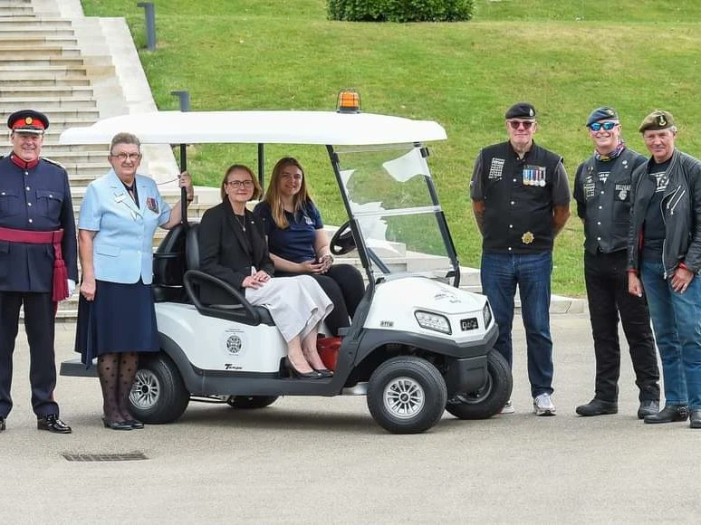 WomenAtWar2's tweet photo. ... the #RideToTheWall community presented the @Nat_Mem_Arb with £150,000 from their fundraising👏 & a new electric buggy, to assist visitors up to see the Armed Forces Memorial. The new buggy has been named after #Wrens #despatchrider Bunty, a regular visitor to the Arboretum. https://t.co/oXxKvTqb72