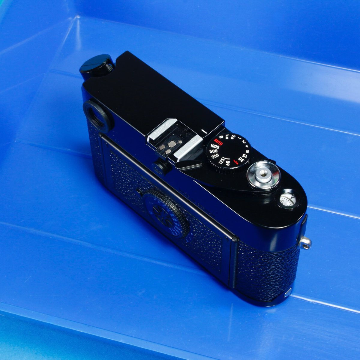 This factory customized Leica M7 A La Carte with black lacquer paint, Red Dot Delete, M3-style advance &amp; frameline preview levers, frameline delete (the finder now shows only 35/50/90mm) and "pebble" leatherette. The result: one of the most beautiful Leica M cameras we've seen.