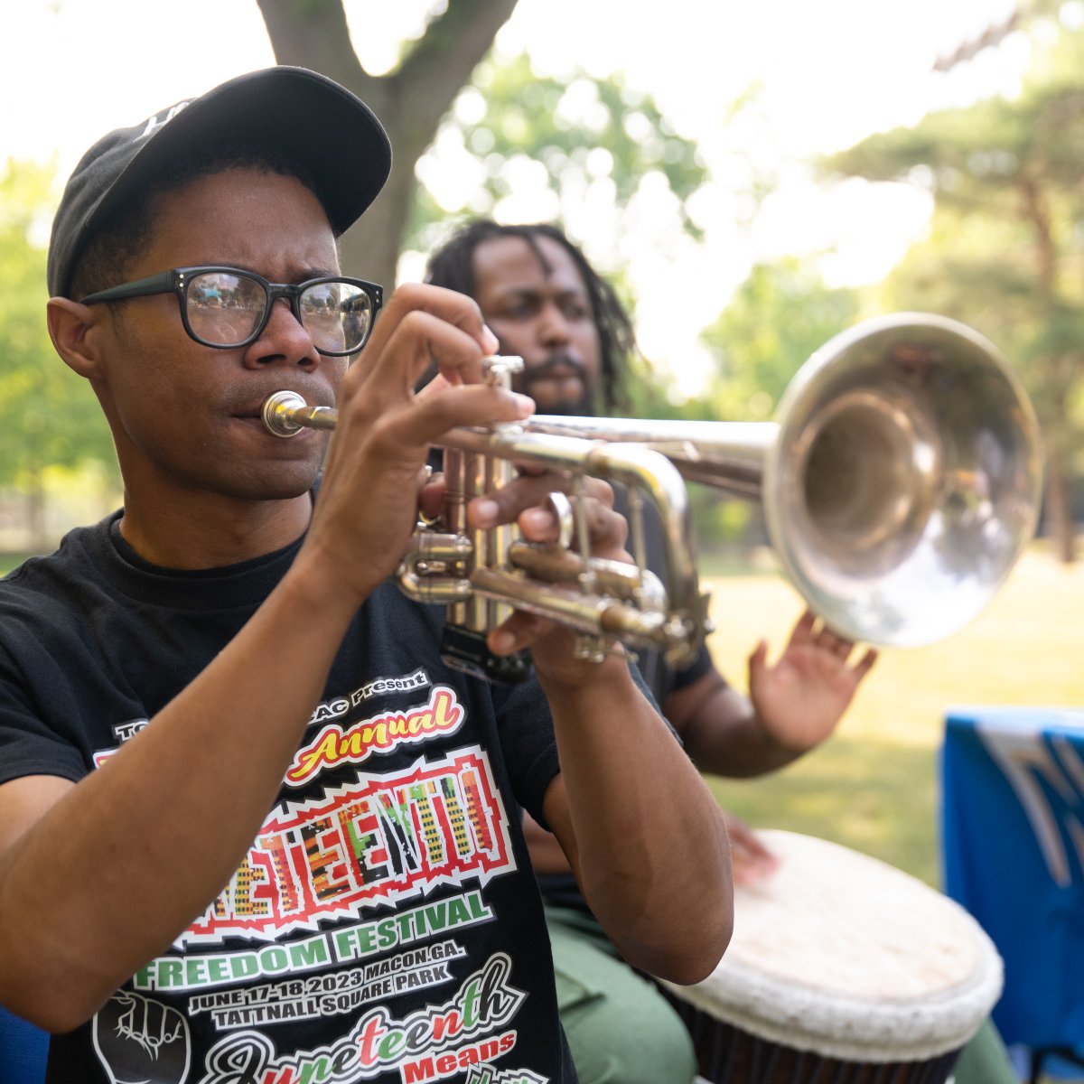 NEIU's tweet photo. A good time was had by all as the #NEIU community came together for our Juneteenth Celebration! Check out the pics from our June 22 gathering, which featured food, live entertainment and games, and a special appearance by @ocartman1. https://t.co/esWkMQRLEY